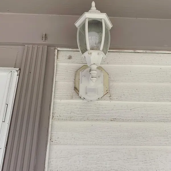 Before and after: outdoor light replaced with Ring floodlight camera (before: original outdoor light)