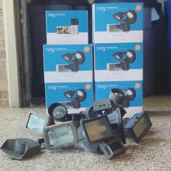Ring floodlight cameras and video doorbells ready to install, with old floodlights removed