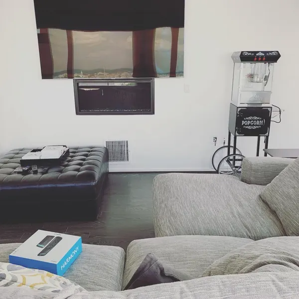 TV mounted above a fireplace in a media room